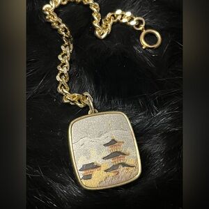 Vintage Sankyo music box pendant with chain